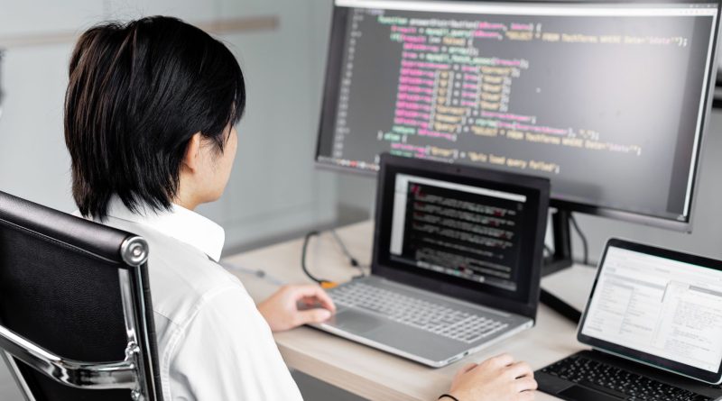 a man sitting in front of the computer while working
